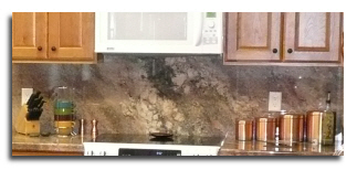 Custom bull backsplash in Green Crema Bordeaux granite